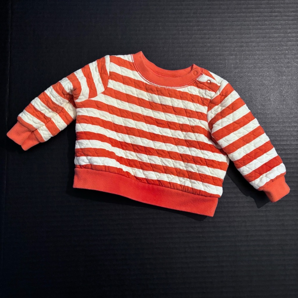 Gently Used Cat and Jack Orange and cream stripped sweater. Size 6/9 months